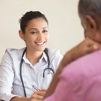 female doctor talking to a patient