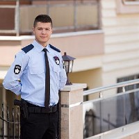 security guard standing outside of a building