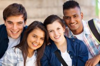 four students smiling