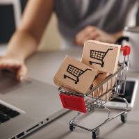 small shopping cart filled with boxes