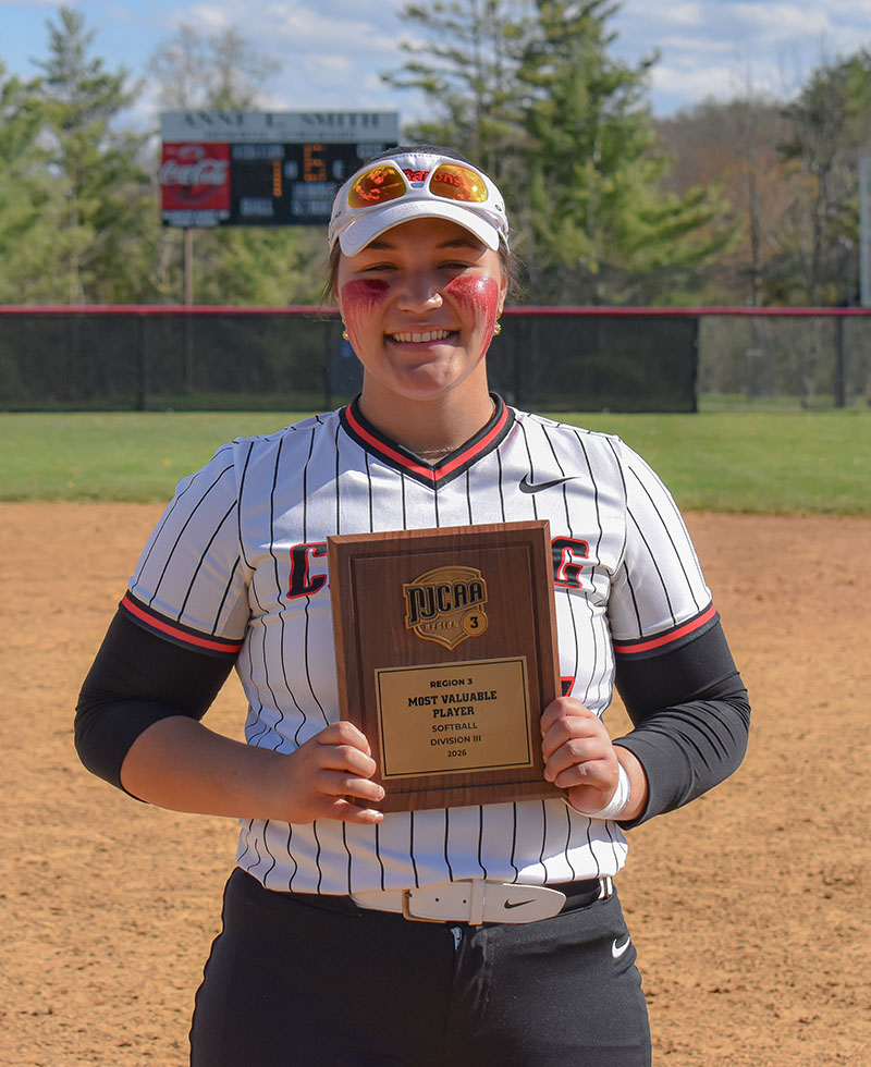 Stella White posing with her Tournament MVP plaque.